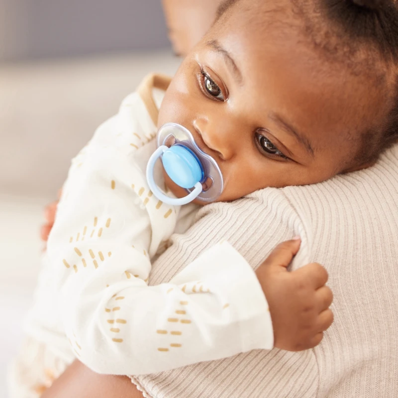 baby being held close up