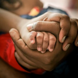family holding hands close up