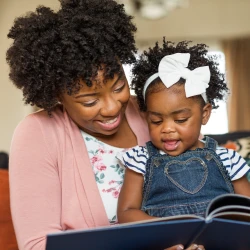 mother reading with baby